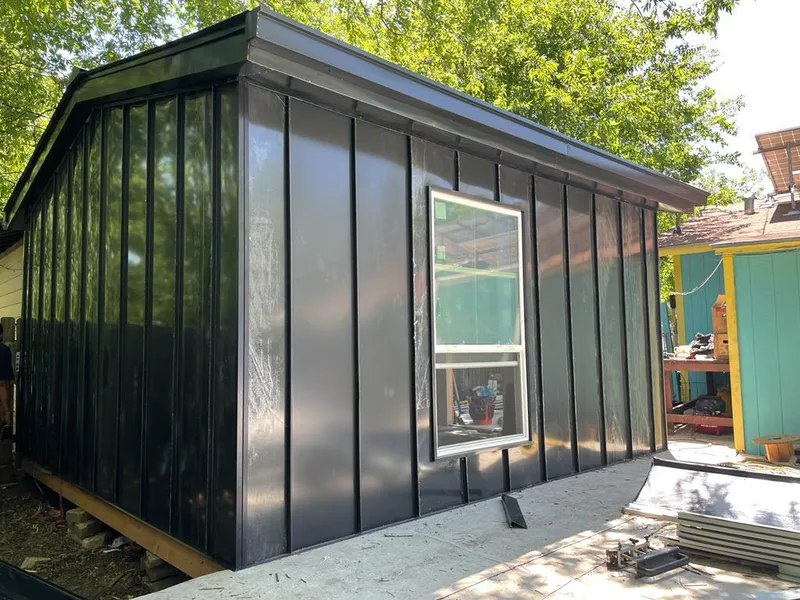 Black standing seam metal wall panels for Roof Inspection in Arvada