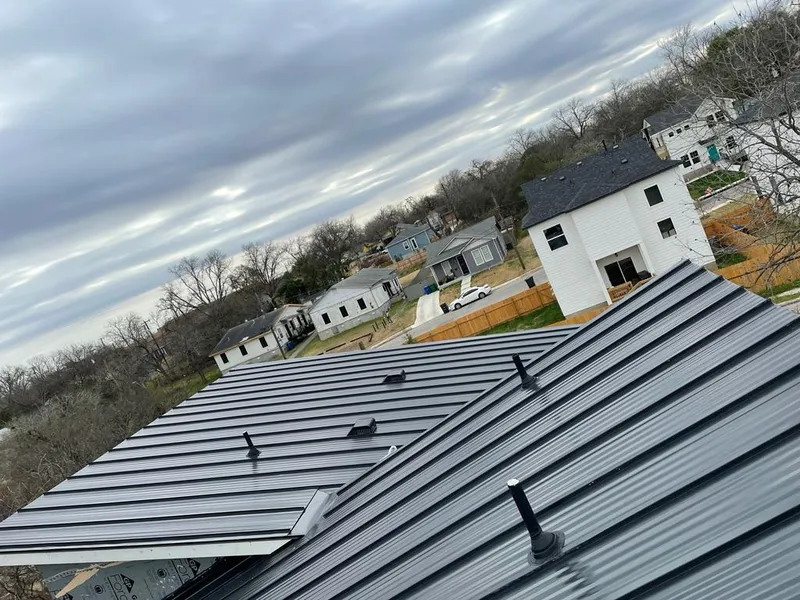 Standing seam metal roof panels with vents for Skylight Repair in Arvada